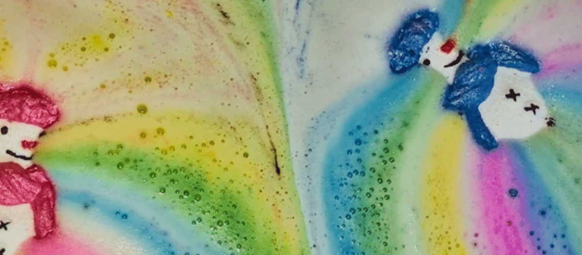 Two snowmen bath bombs dissolving in bath water